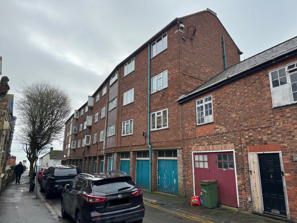 Lot: 147 - TWO-BEDROOM APARTMENT WITH SEA VIEWS - Bayle Court roadside elevation